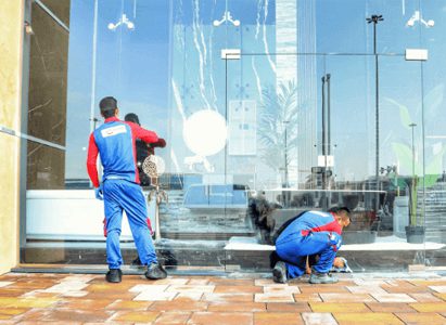 Shopfront glass cleaning in Doha by Emerald team