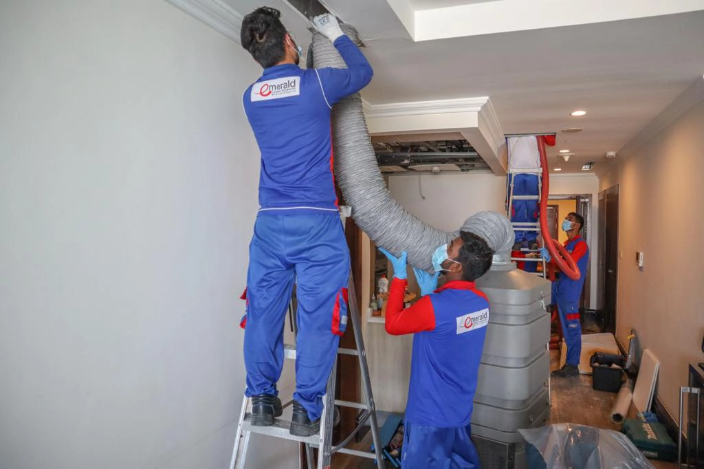 Robotic HVAC duct cleaning technician working in Doha villa
