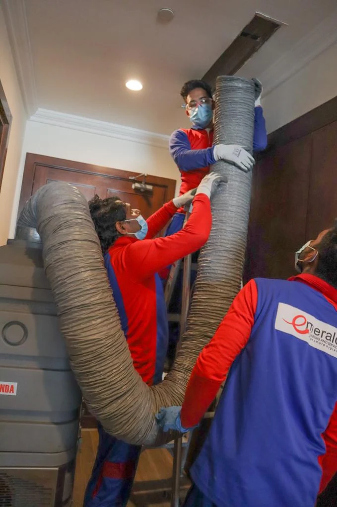 Emerald technicians doing air duct cleaning in a Doha villa