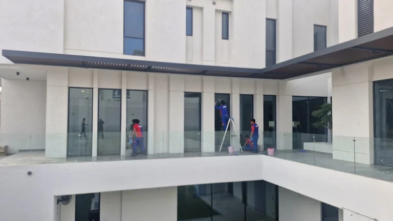 Villa glass window cleaning on a terrace in Doha, Qatar