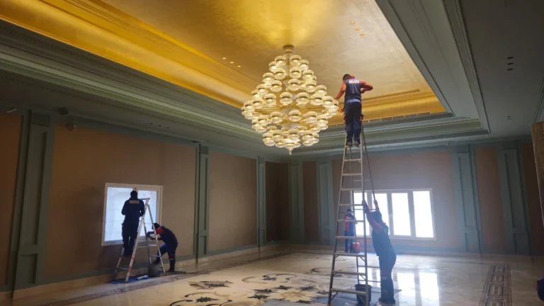Chandelier and window cleaning team at a villa in Doha