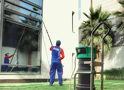 Villa exterior window cleaning with water-fed pole in Qatar