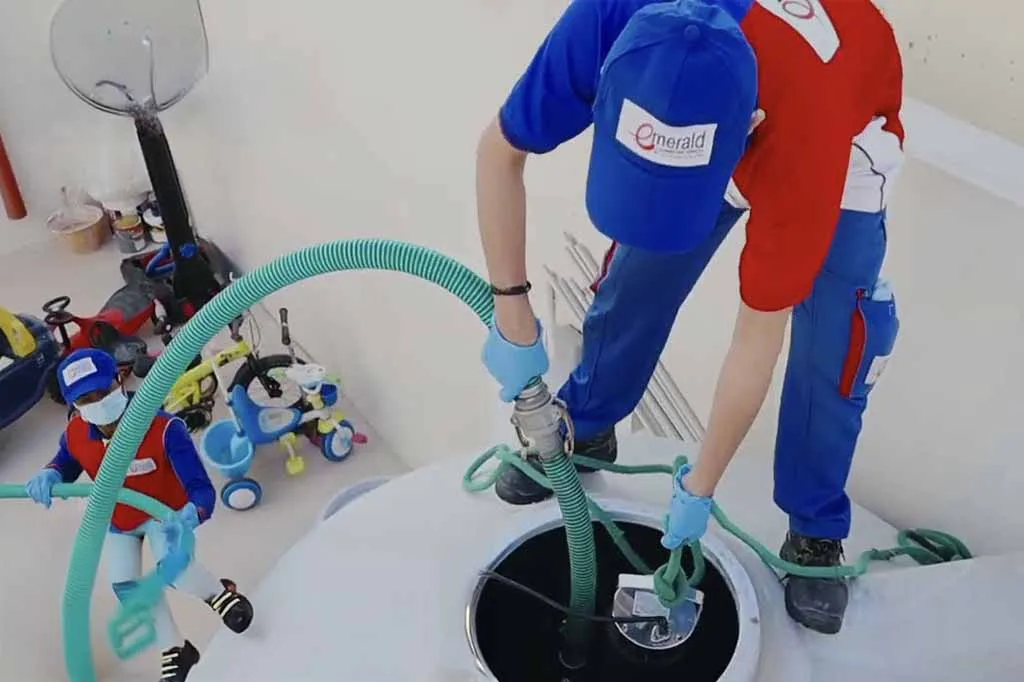 Technician cleaning a water tank in Doha, Qatar